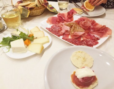 Traditional Modenese cuisine: tigelle with scrumptious meats & cheeses